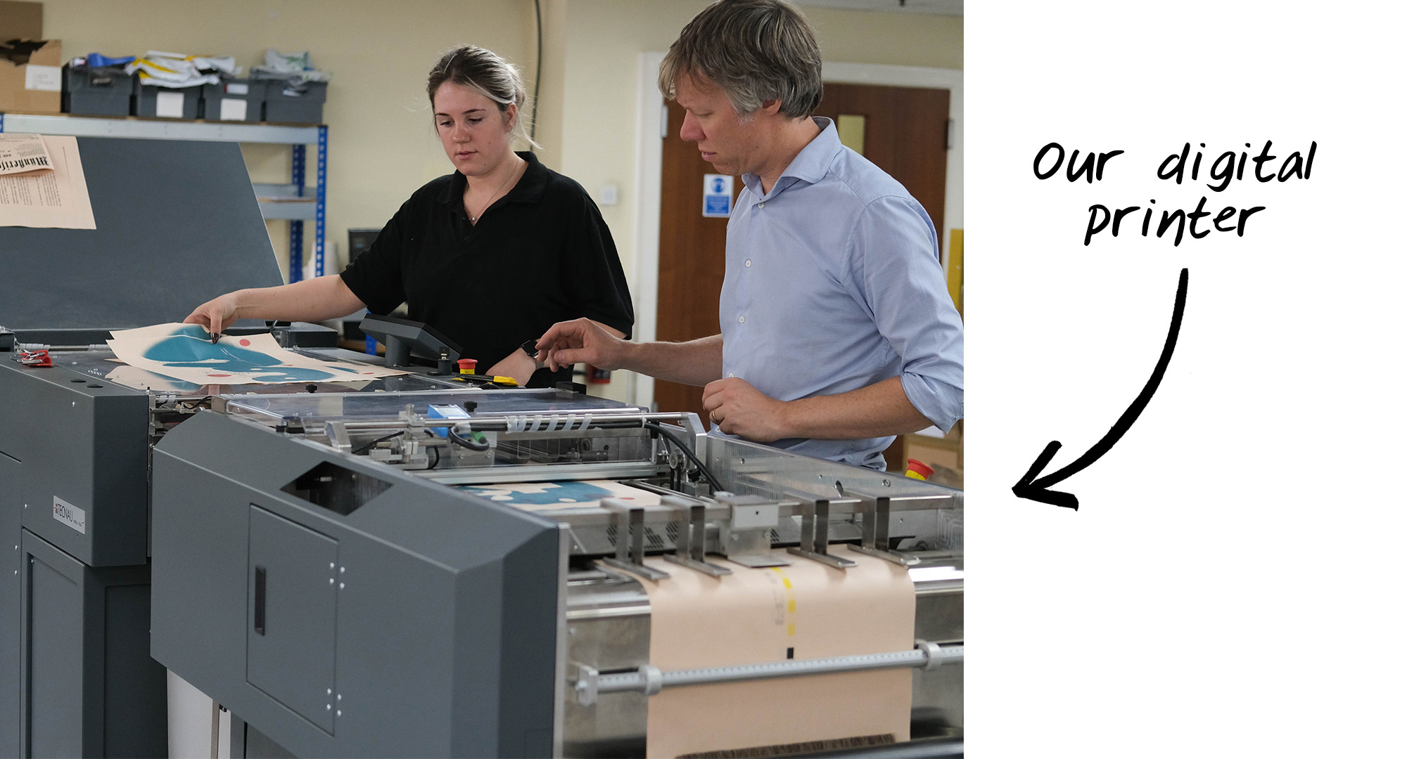Staff overseeing the printing process on Newspaper Club’s digital newspaper printer.
