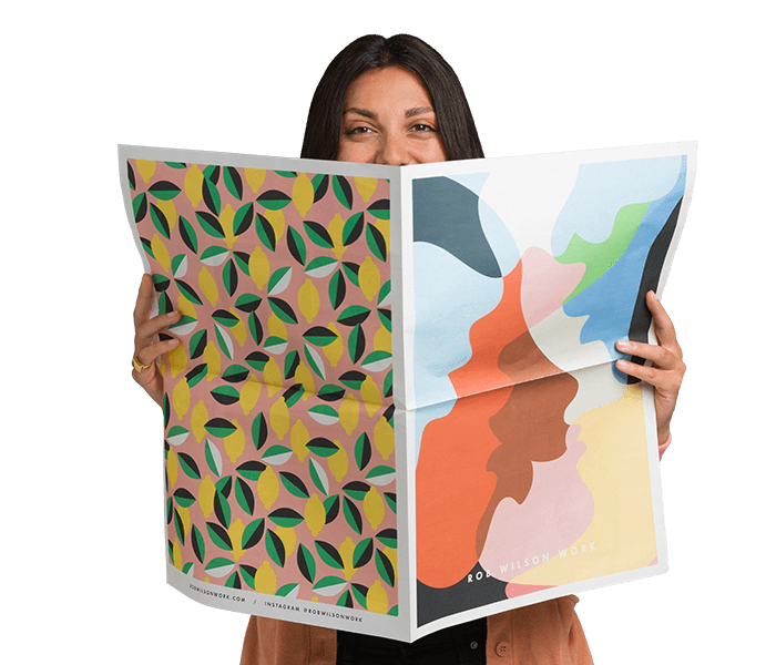 Woman holding broadsheet-sized newspaper.